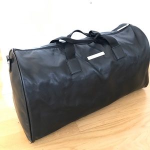 Black leather Versace Parfums Duffle